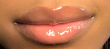 Load image into Gallery viewer, Cloud 9 clear lip gloss worn on lips with darker skin tone 
